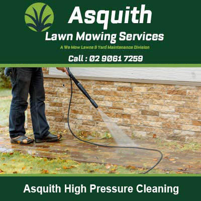 Person using pressure washer to clean in Asquith