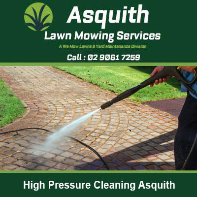 Person pressure washing a brick patio in Asquith