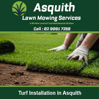 Hands in work gloves placing fresh turf in Asquith